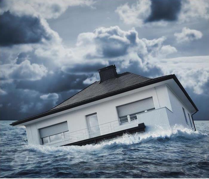 a house floating in a large body of water